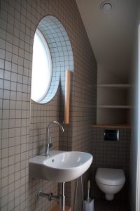 Mosaic tiled bathroom industrial style