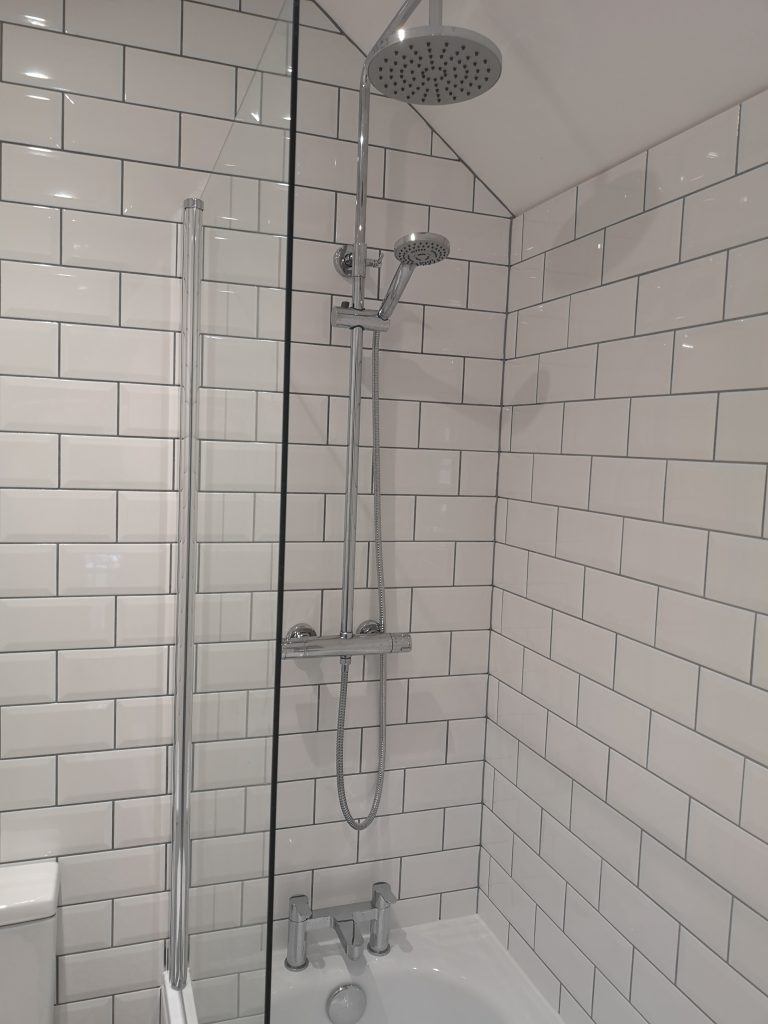 bathroom with white metro tiles and grey grout by south London kitchen and bathroom fitters
